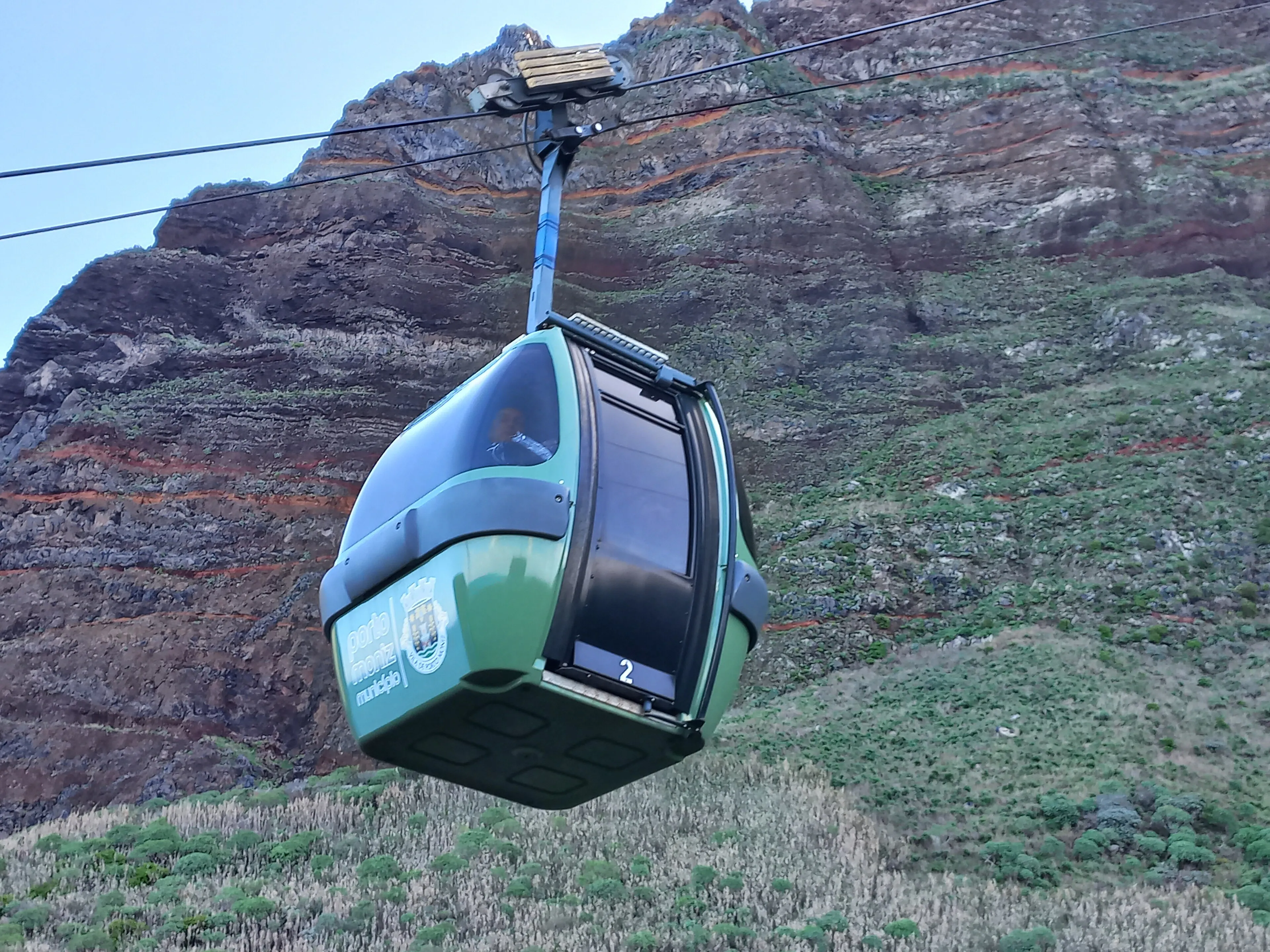 A cabin of the Achadas da Cruz cable car above the cliff