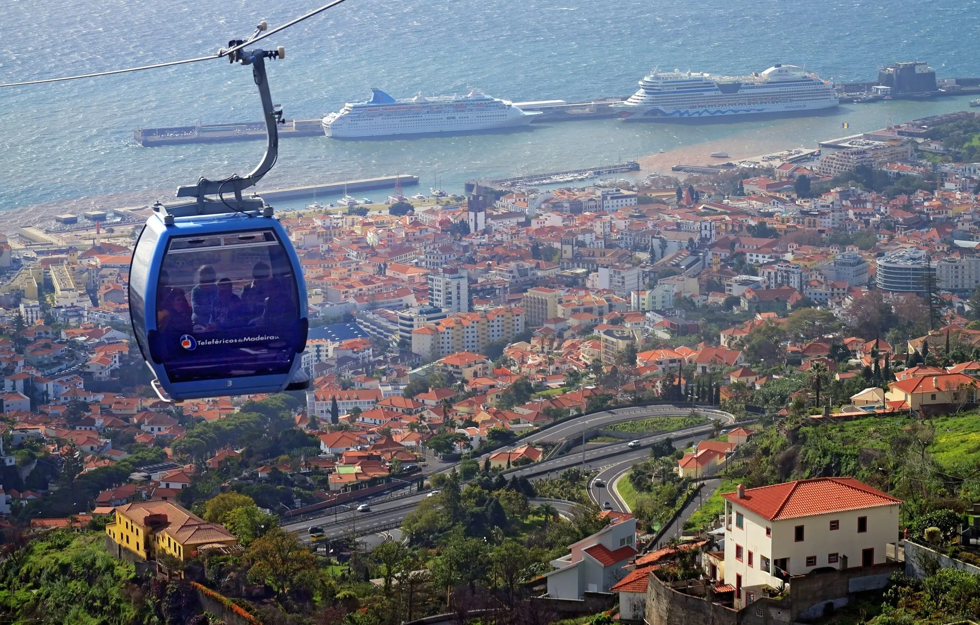 A cabin of the Funchal cable car above the city