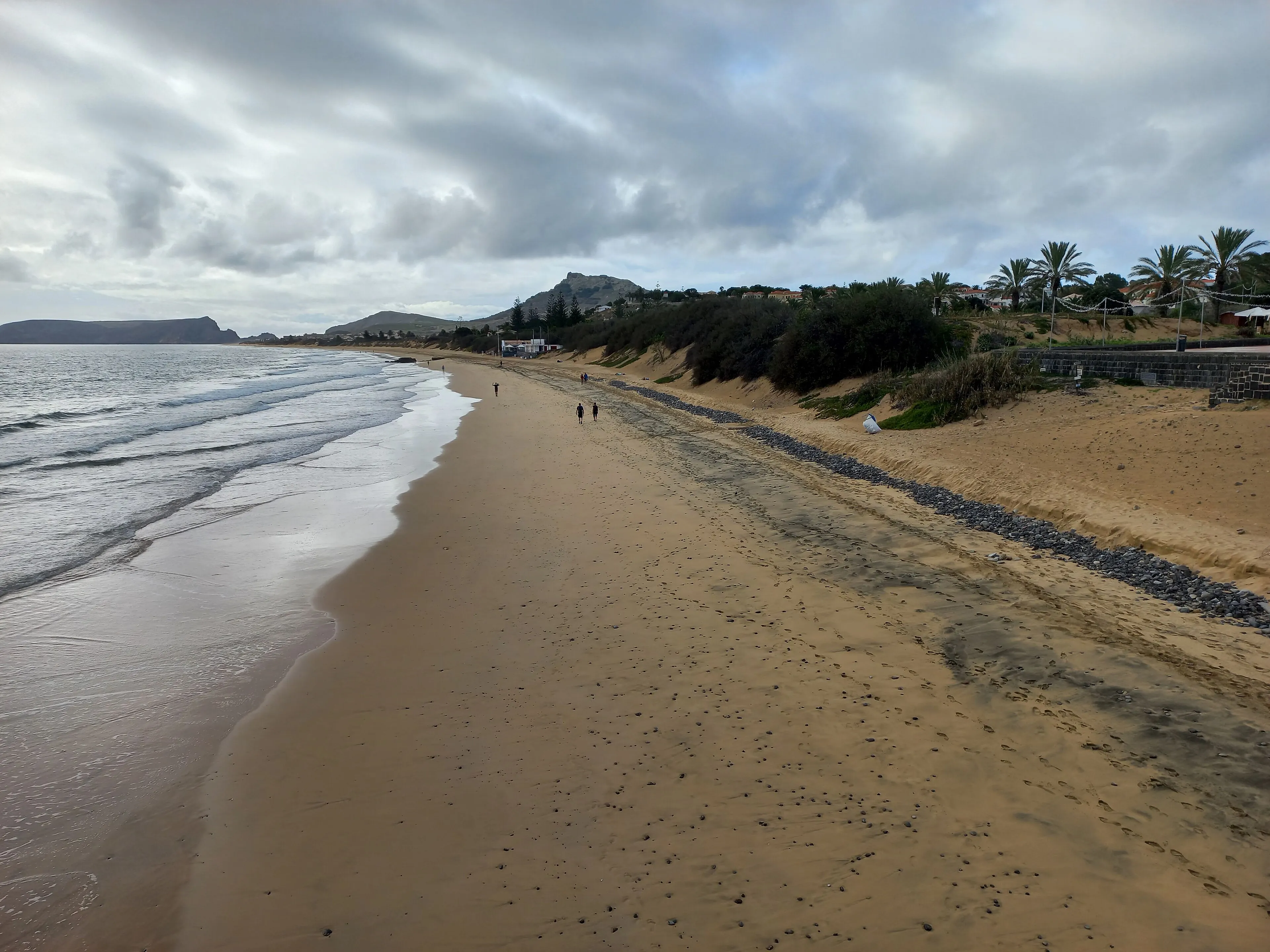 The sand at Porto Santo with Ilhéu da Cal in the distance