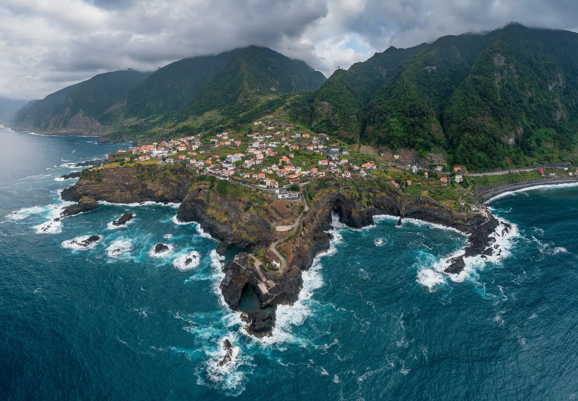 The village of Seixal on its headland
