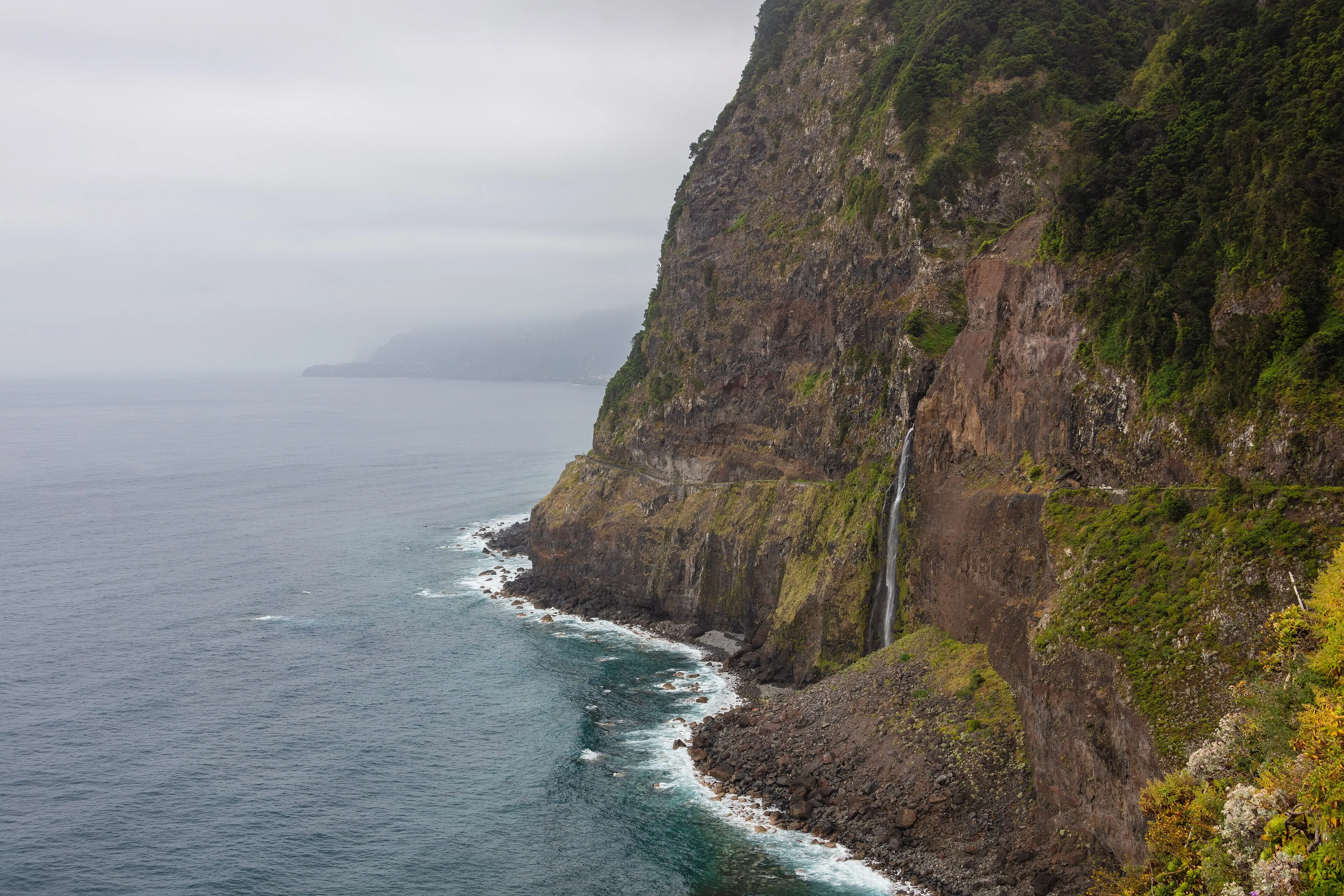 The Véu da Noiva waterfall falling to the sea